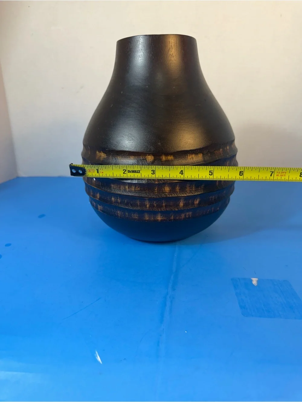 hand-carved wooden vase with contrasting texture